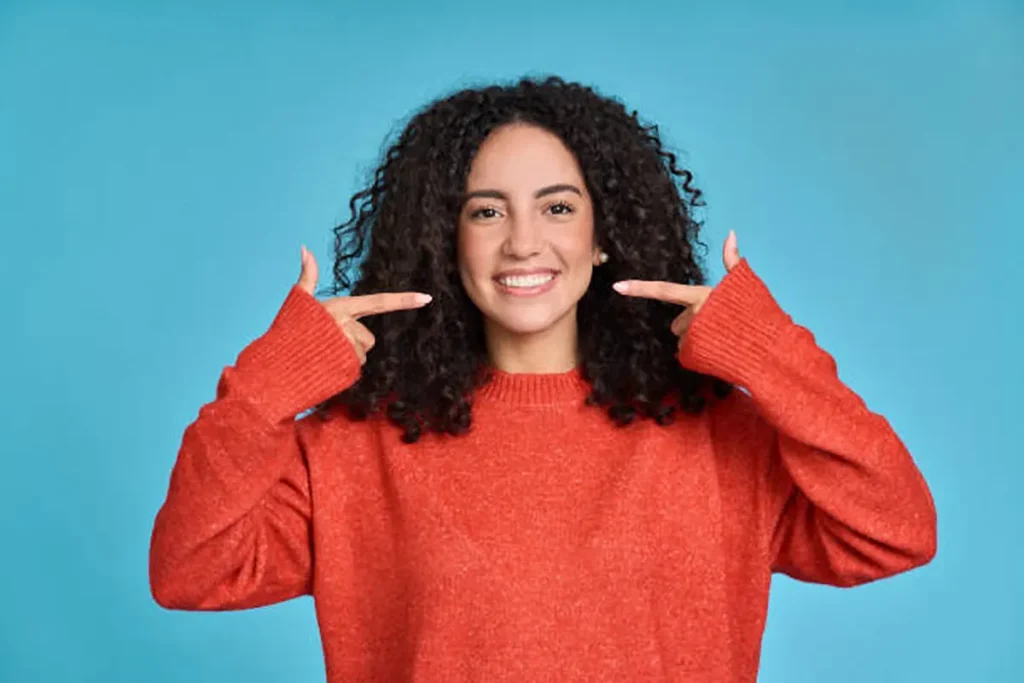 girl showing her whitten teeth