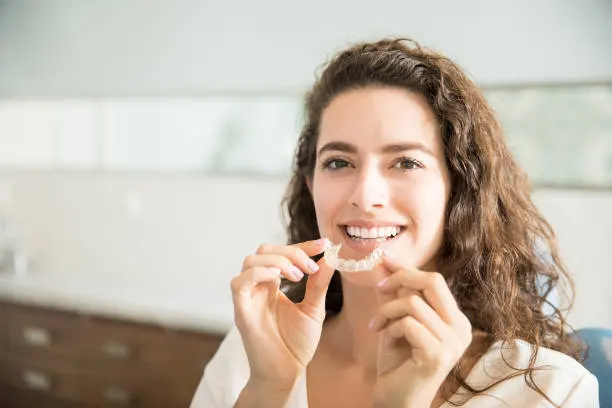 girl showing her Dental Invisalign