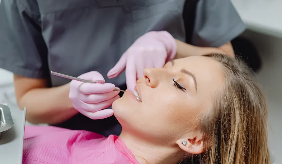 dentist checking wisdom teeth of a patient